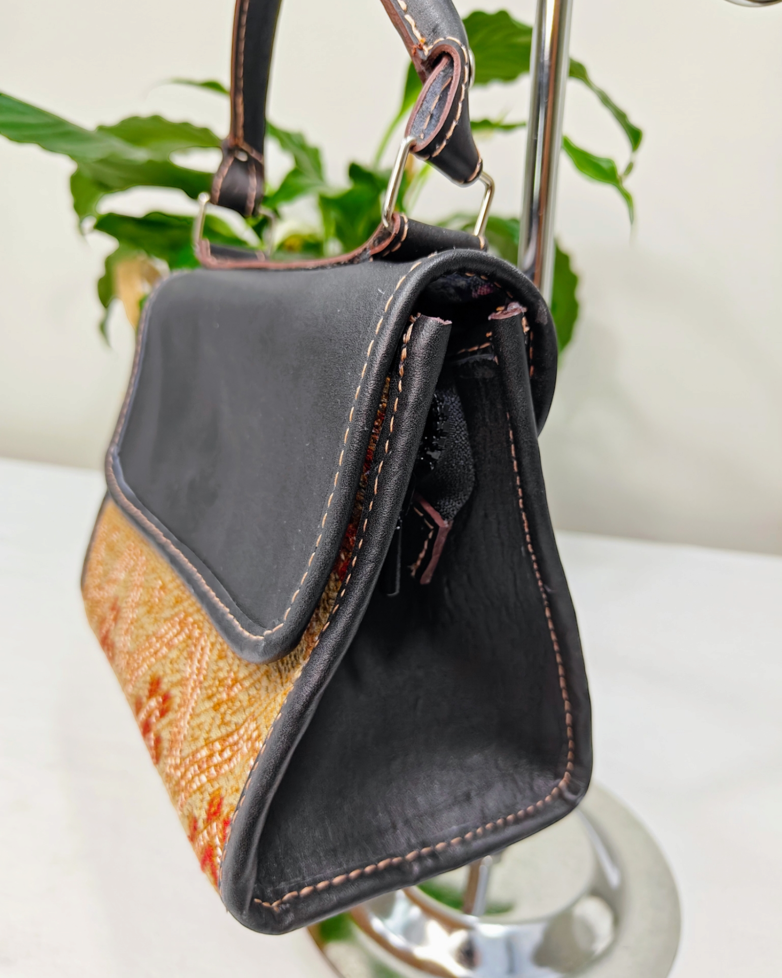 Elevate Your Style with The Small Black Handheld Handbag by Aura Maya Copper Golden
